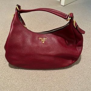 Brand new, never used Prada red purse with brown interior